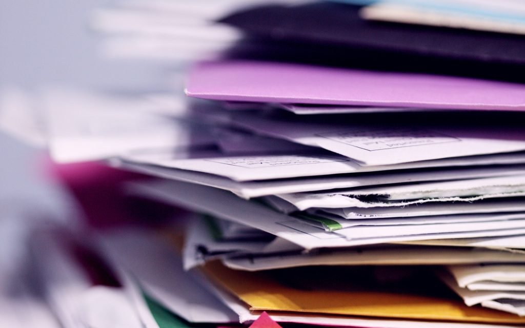 A stack of accountants' paperwork and files.